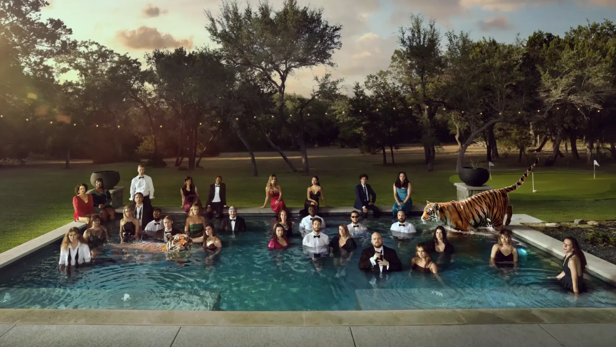 adage-awards A big group of people and one tiger in a pool in a middle of a golf course.