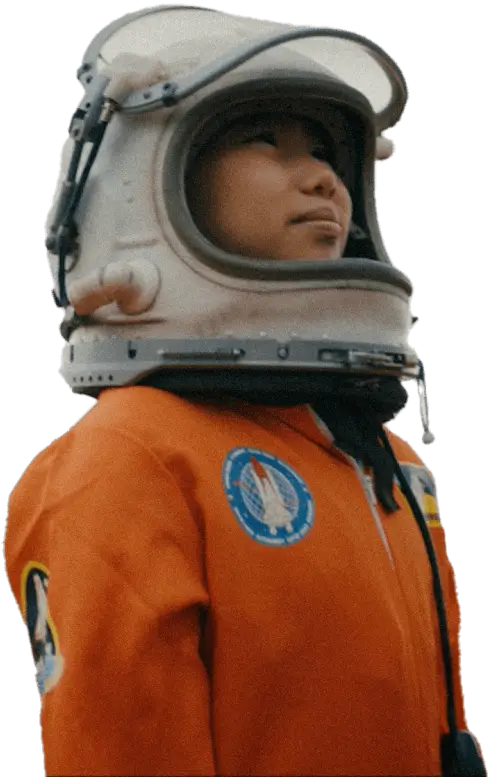 Kid in an orange spacesuit and a helmet.